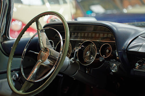 istock Vintage car interior with steering wheel and dashboard 2248581757