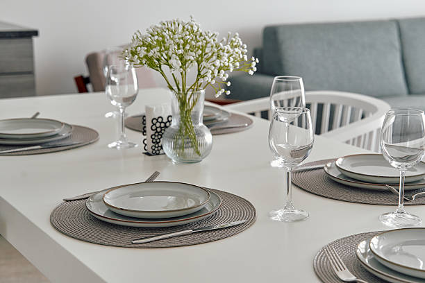 istock Elegant Dining Table Setting with Fresh Flowers and Tableware for a Sophisticated Dining Experience in a Modern Home Environment 2248583177