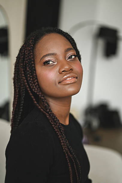Young adult woman showing a confident and beautiful expression
