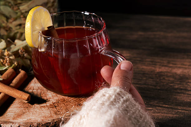 red hibiscus tea in a glass cup isolated on white background