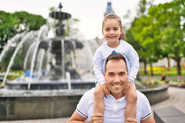 istock father and his cute daughter having fun outdoors 2248588975