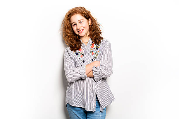 istock Beautiful readhead girl with on studio white background 2248589624