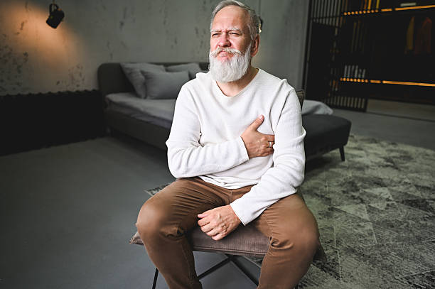 istock Senior man experiencing chest pain at home 2248590027