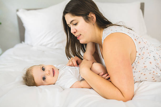 istock A Mother and baby on bed having fun 2248590115