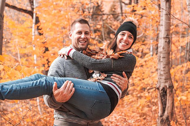 istock happy autumn fall couple in a park 2248590973