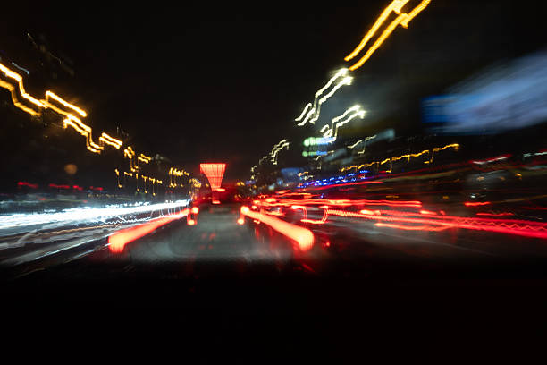 A chaotic explosion of colorful light trails at night. This abstract long exposure captures urban speed and raw energy, creating a dynamic and vibrant background.