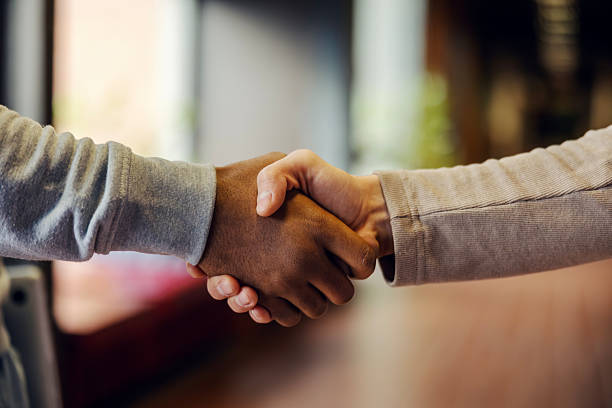 istock People shaking hands making a business agreement and deal 2248592450