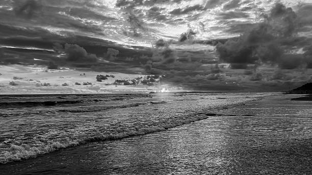 istock Black and White Seascape View of Shoreline and Ocean Wave 2248592941
