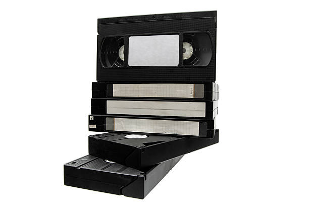 istock Stack of black VHS tapes and two lying flat, isolated on a white background. 2248593406