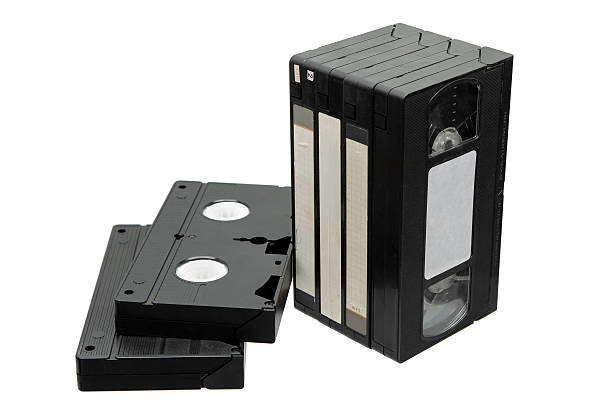 istock Stack of black VHS tapes and two lying flat, isolated on a white background. 2248593413