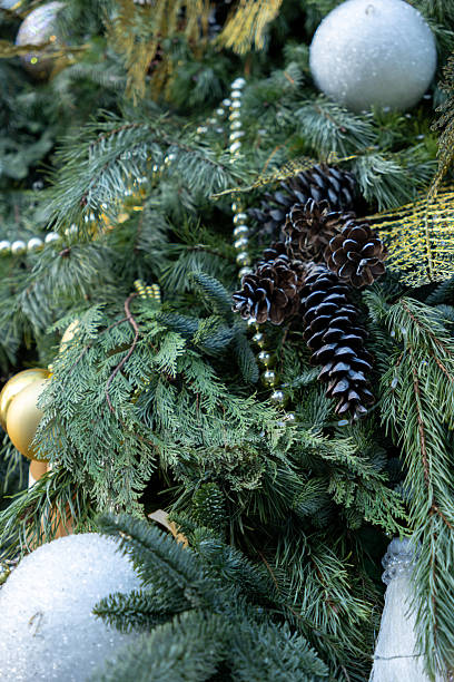 istock Christmas tree with many ornaments and pine cones. 2248594604