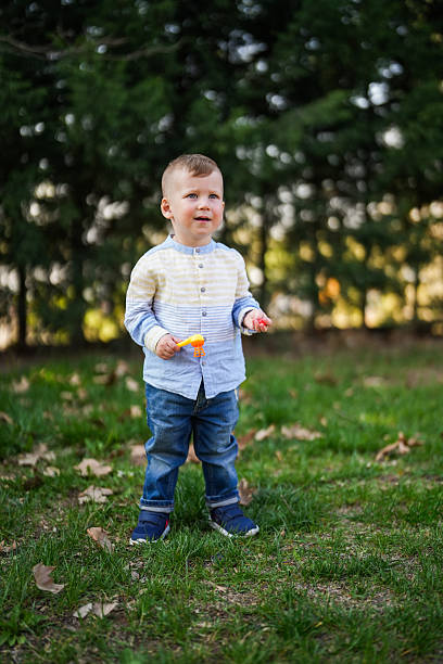 istock Cute Toddler Playing Outdoors on a Sunny Day 2248597186