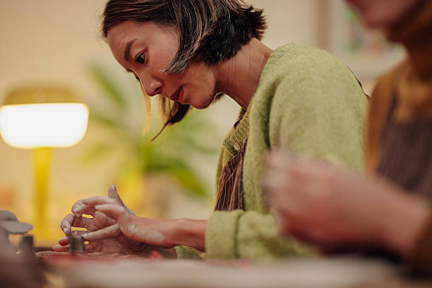 istock Woman working with clay in pottery workshop 2248598921