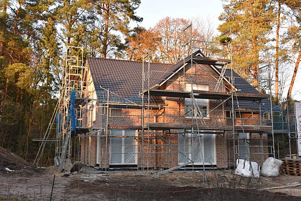 istock A detached house under construction, surrounded by scaffolding. 2248602752