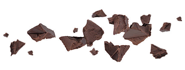 istock Chunks of crushed dark chocolate fly and levitate in space. Isolated on white. 2248604733