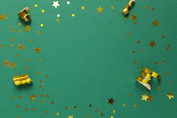 Golden confetti on color background, top view