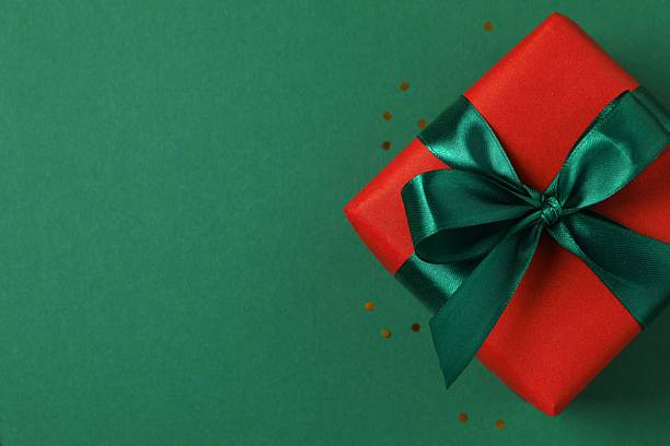 istock Festive gift box on color background, close-up view 2248609250