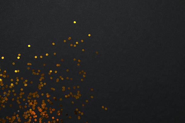 istock Festive golden confetti on black background, top view 2248609870