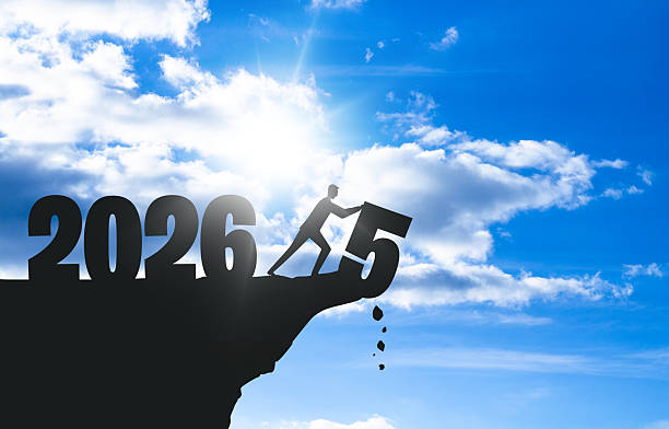 istock 2026 New Year Man Silhouette Pushing Number 5 Cliff Edge 2248609959
