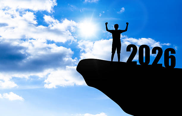 istock 2026 New Year Winner Silhouette Arms Raised On Cliff 2248609966