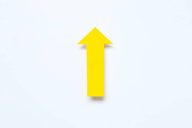 istock Yellow paper arrow on white background 2248610350