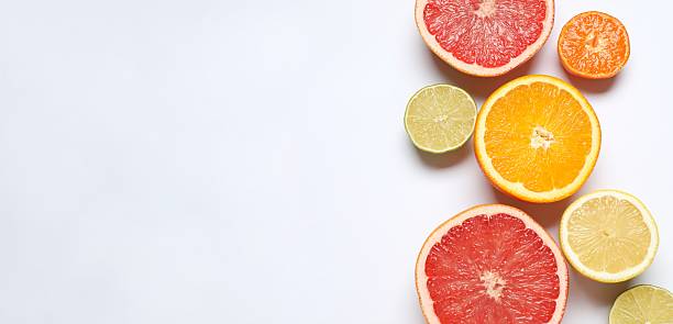 istock Tropical citrus fruits on a white background. Summer concept. Flat lay, top view, space for text 2248612969