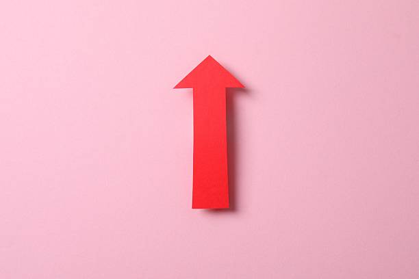 istock Paper arrow on color background, top view 2248613032