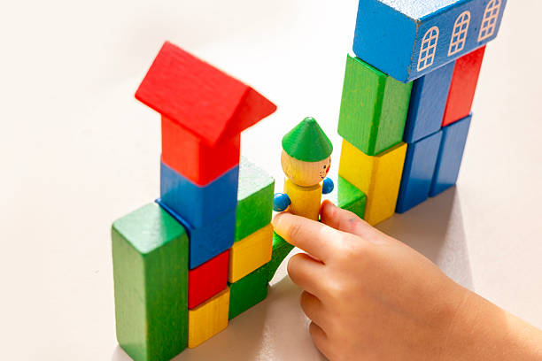 istock child 5 years old stacking blocks, Building castles, playing educational wooden geometric figures, childhood earlier child development, Educational play toy blocks develops motor and thinking skills 2248614534