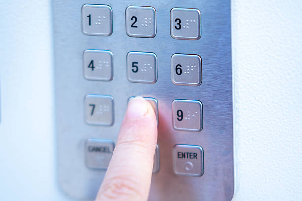istock Close-up human finger pressing number on digital keypad safe or security box for entering confidential access digital code, verification, person confirming identity or protecting personal belongings 2248614635