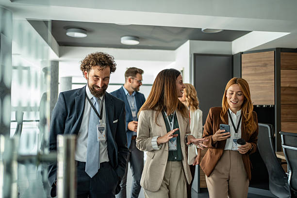 istock Business professionals walking and talking during corporate event 2248619949
