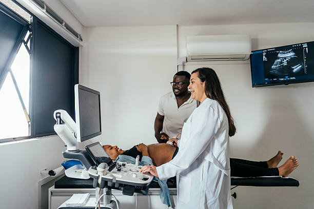 istock Black woman undergoing prenatal exam with her husband. 2248620864