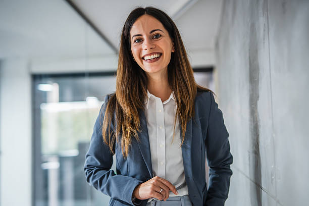istock Confident businesswoman smiling in modern office environment 2248623343