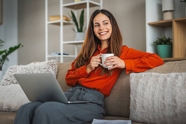 istock Woman enjoying coffee break while working remotely at home 2248623383