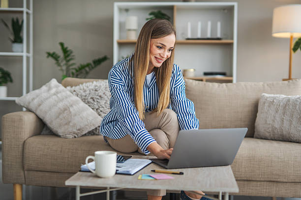 istock Woman working remotely on laptop at home 2248623385