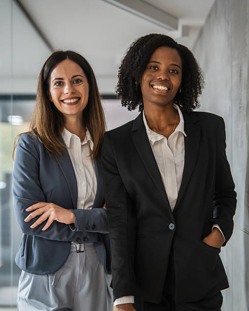 istock Diverse businesswomen smiling together in modern office 2248623437