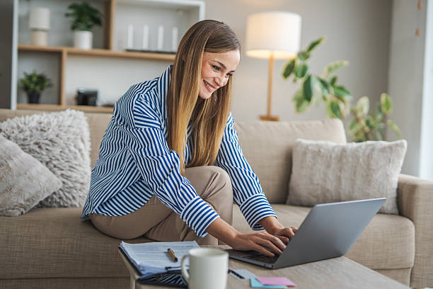 istock Woman working remotely on laptop at home 2248623589