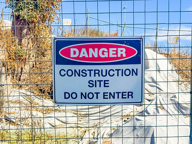 istock A Construction Site warning sign on a fence 2248624094