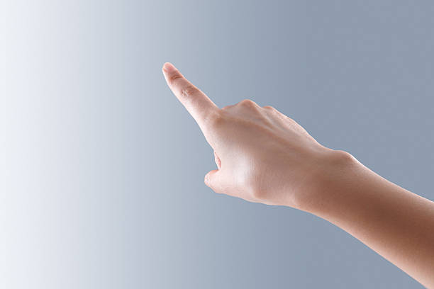 istock Hand Pointing and Gesturing Close-Up on Blue Background 2248626110