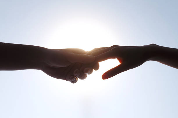 istock Young Woman and Man Handshake Silhouette - Trust and Partnership 2248626392