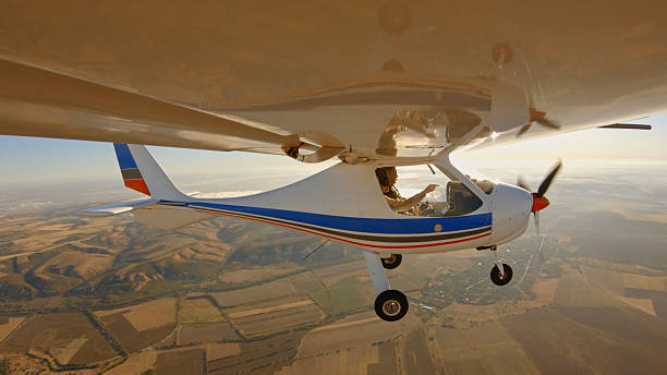 istock Focused Pilots Talk Into The Headset As They Fly A Personal Airplane 2248626818