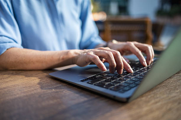 istock Typing on laptop keyboard, working remotely from home 2248626889