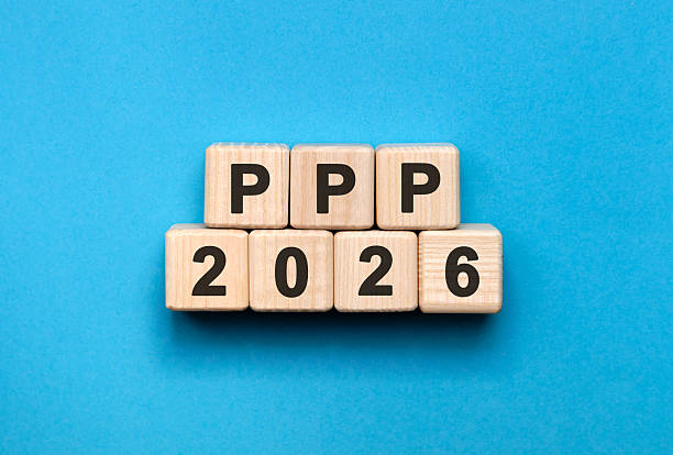 istock PPP New year 2026 concept. Wooden cubes on a blue background 2248627211