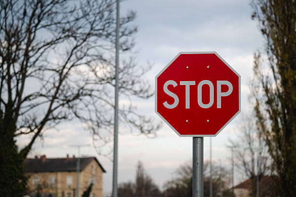 istock Red stop sign on suburban street 2248627576