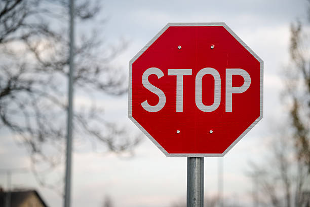 istock Red stop sign on suburban street 2248627585