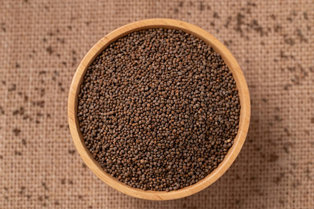istock Dried perilla seed in a bowl on brown background 2248629887