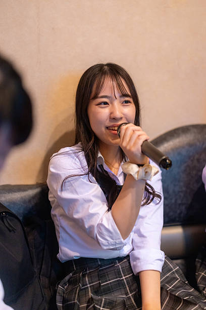 Female high school students singing songs in karaoke box