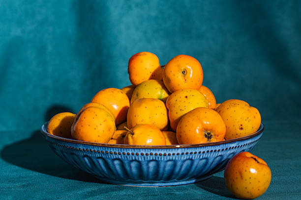 istock Tejocotes fruit filling blue ceramic bowl 2248634731