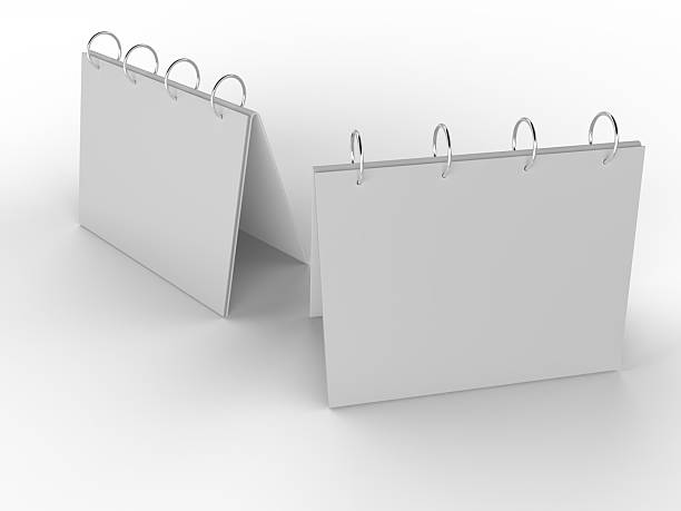 istock 3D mockup of a blank standing desk calendar with spiral binding on isolated background. Ideal for branding, stationery design, schedule templates, office planner or notepad and product presentation. 2248636344