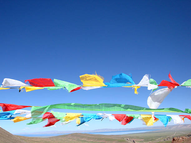 istock Colorful prayer flags fluttering under a clear blue sky 2248643066
