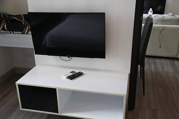 istock a white low table with an empty space on the top, next to it is a tv stand 2248645855